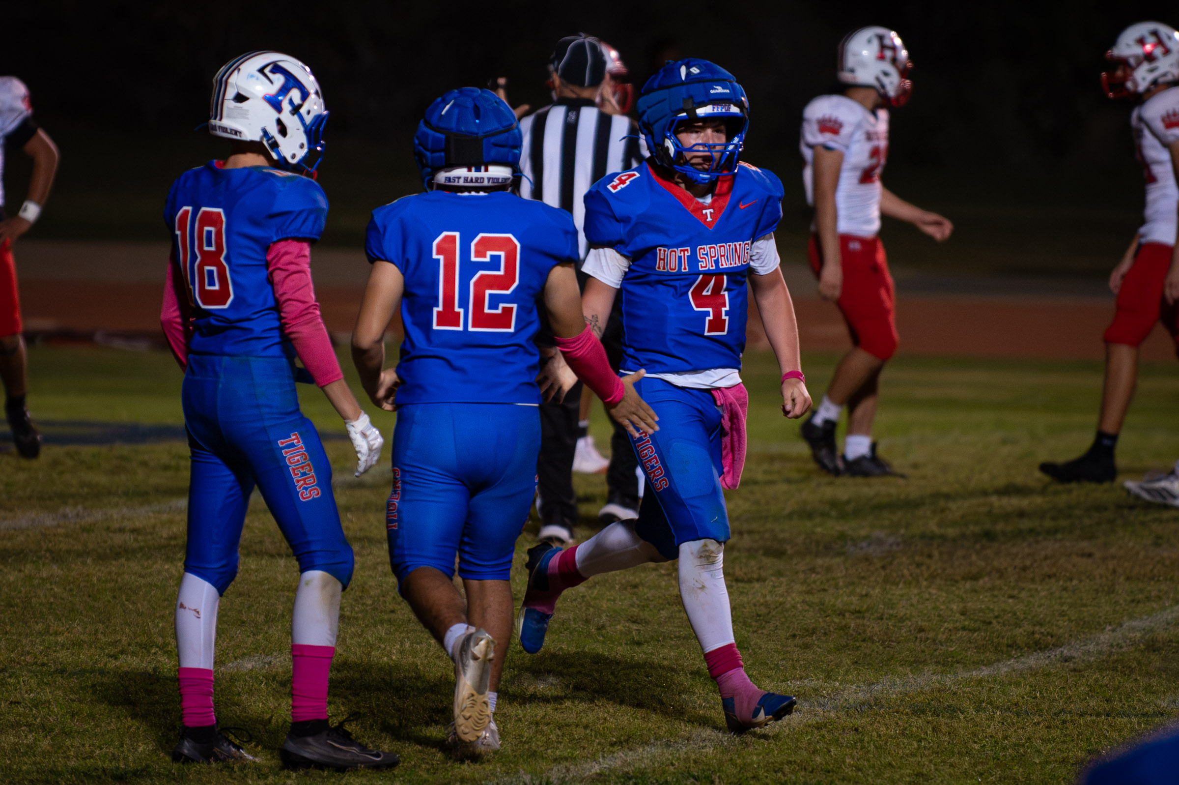 Hot Springs quarterback Zaiden Baker (#4) celebrates a touchdown with teammates against Hatch Valley.