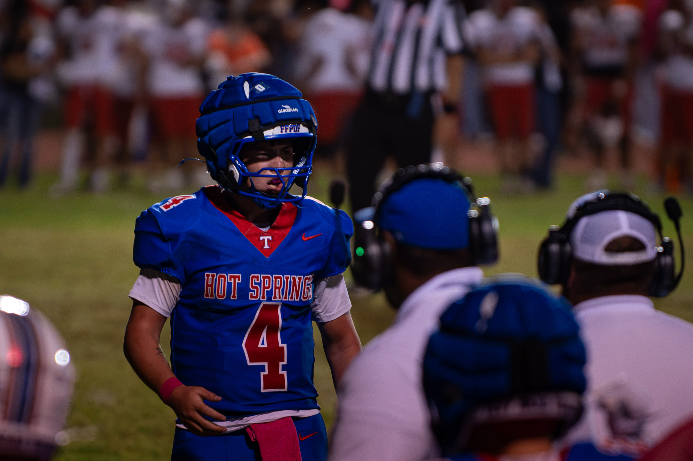 Hot Springs quarterback Zaiden Baker (#4) looks toward coaches on the sideline after scoring a touchdown against Hatch Valley.