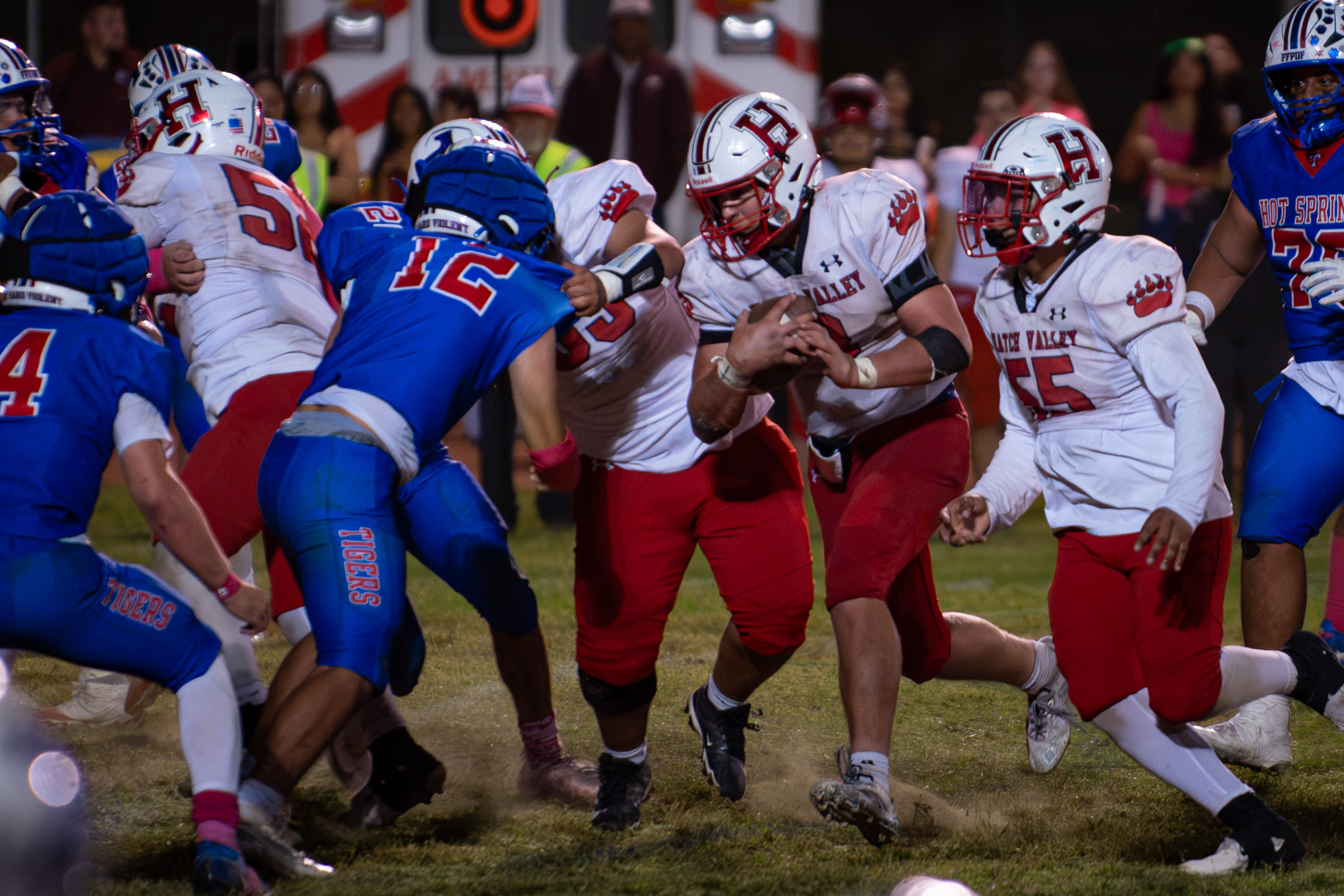 Hatch Valley senior Peet Bothma (#8) carries the ball through traffic as Hot Springs defenders close in.